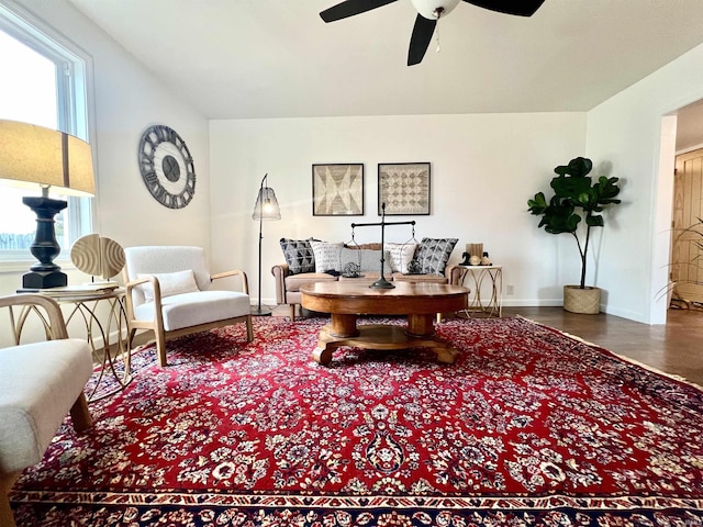 living room featuring ceiling fan, hardwood / wood-style floors, and a wealth of natural light