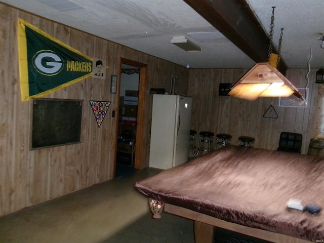 game room with pool table and wood walls