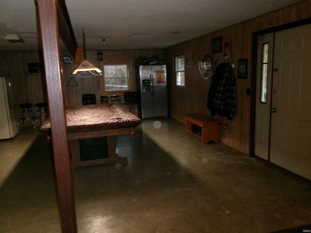 interior space featuring wooden walls