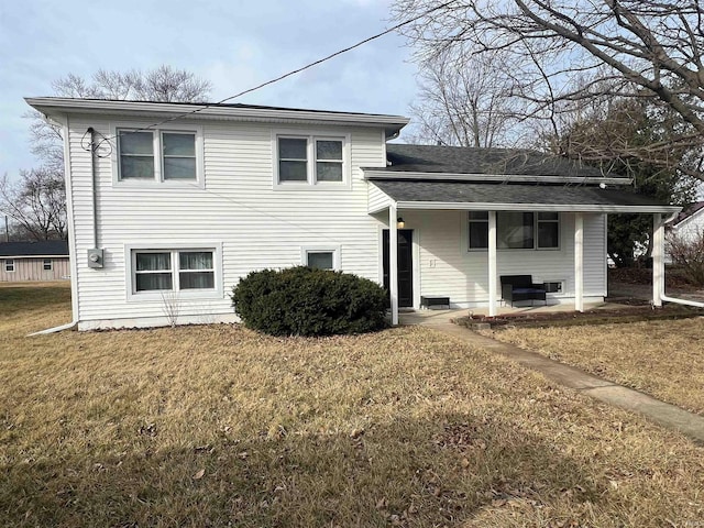 view of front of home with a patio area and a front yard