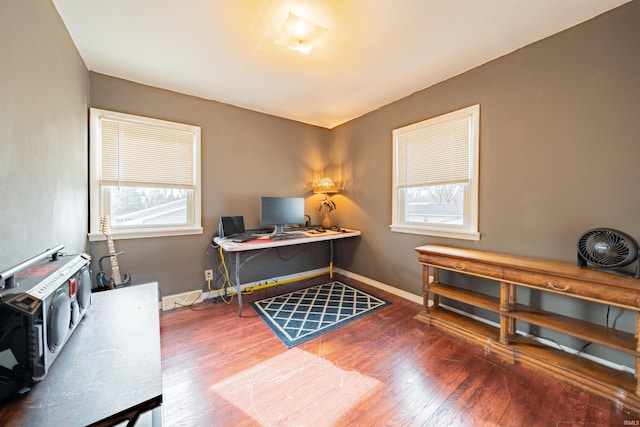 office space with dark wood-type flooring