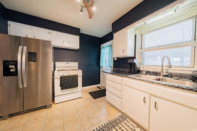 kitchen with white cabinetry, white gas range, sink, light tile patterned floors, and stainless steel fridge with ice dispenser