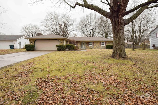 ranch-style house featuring a garage and a front yard