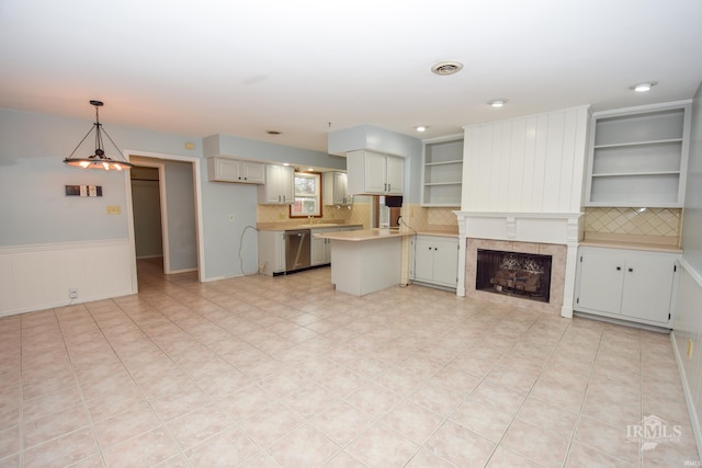 kitchen featuring dishwasher, white cabinetry, hanging light fixtures, a center island, and decorative backsplash