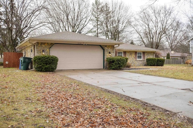 ranch-style home with a garage and a front yard