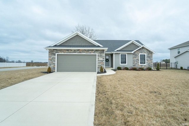 view of front of property with a garage and a front lawn