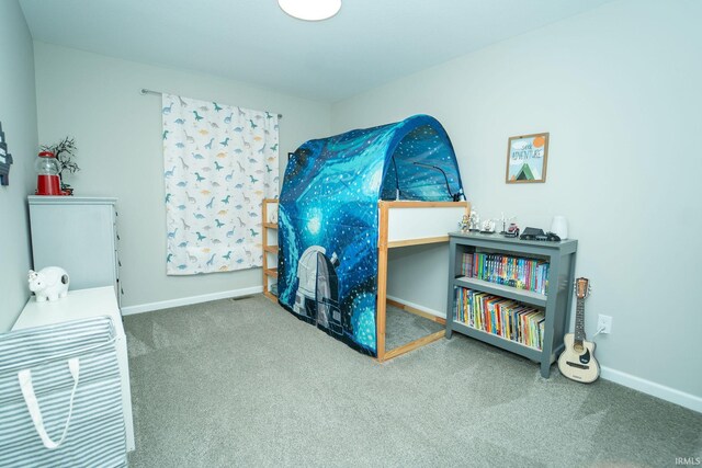 bedroom featuring carpet