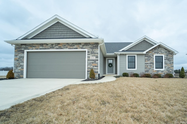 view of front of home with a garage and a front lawn