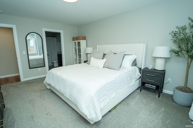 bedroom featuring carpet and connected bathroom