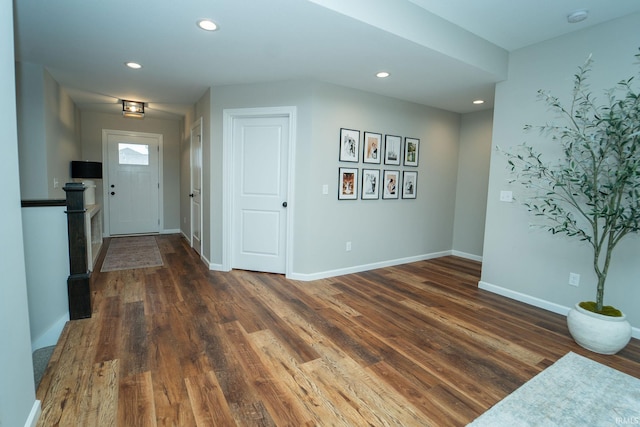 entryway with dark hardwood / wood-style floors