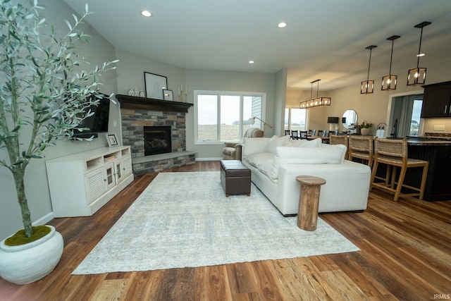 living room featuring dark hardwood / wood-style floors and a fireplace