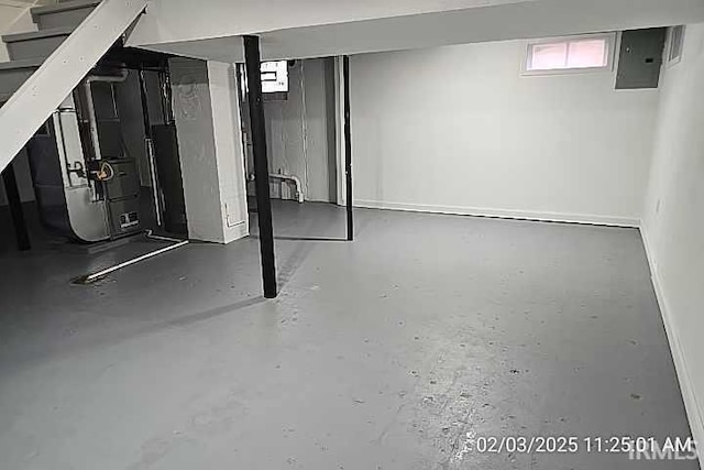 basement with heating unit and electric panel