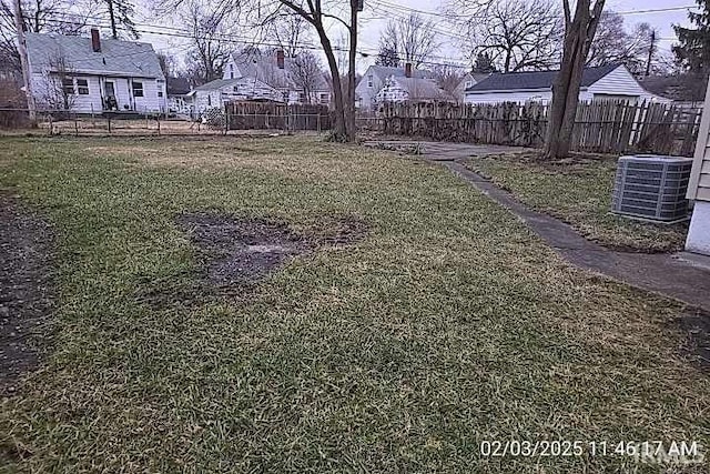 view of yard with central AC