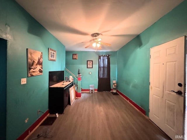 misc room featuring hardwood / wood-style flooring and ceiling fan