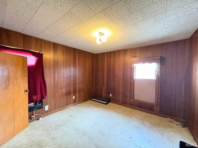 empty room with wooden walls