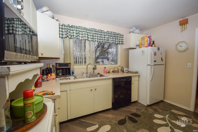 kitchen featuring white refrigerator, dark hardwood / wood-style floors, dishwasher, and sink