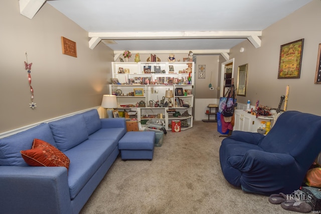 living room with beamed ceiling and light carpet