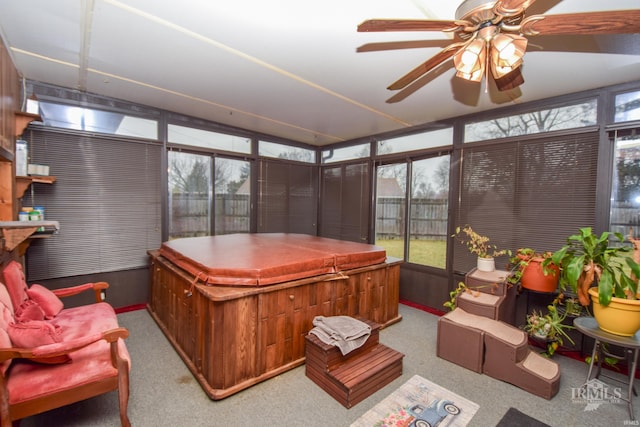 sunroom / solarium featuring ceiling fan