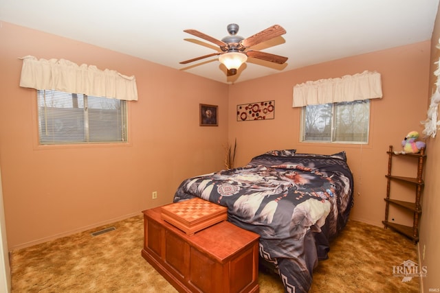 carpeted bedroom with ceiling fan