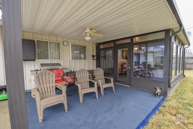 view of patio featuring ceiling fan