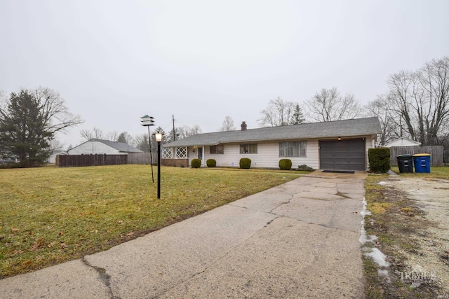 ranch-style home with a garage and a front yard