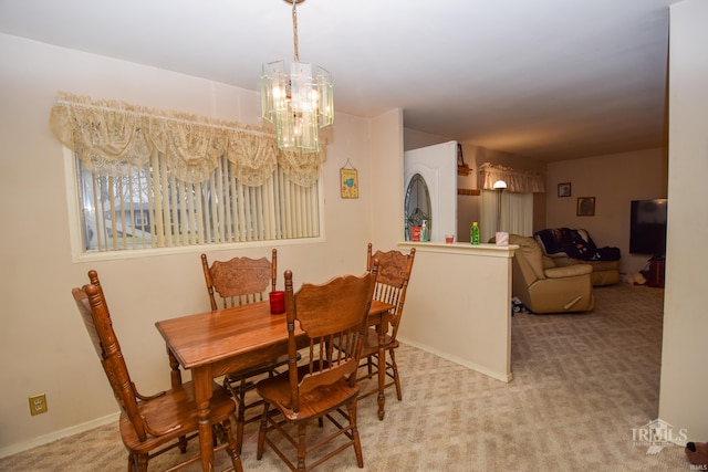 view of carpeted dining area