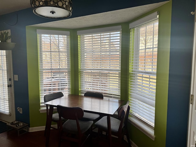 dining space with a textured ceiling