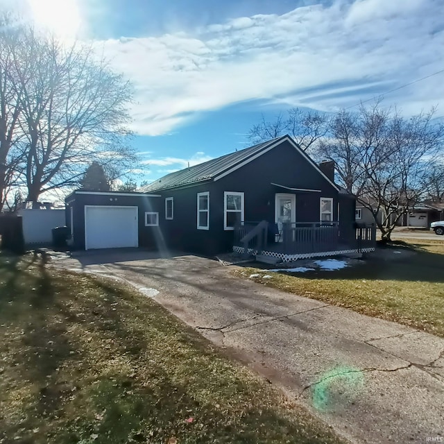 view of front of property with a garage and a front yard