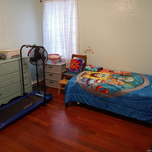 bedroom featuring dark hardwood / wood-style flooring