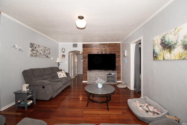 living room featuring ornamental molding and dark hardwood / wood-style flooring