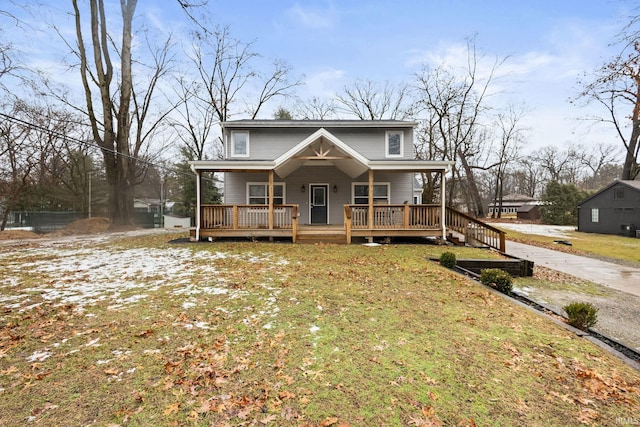 view of front facade with covered porch and a front lawn