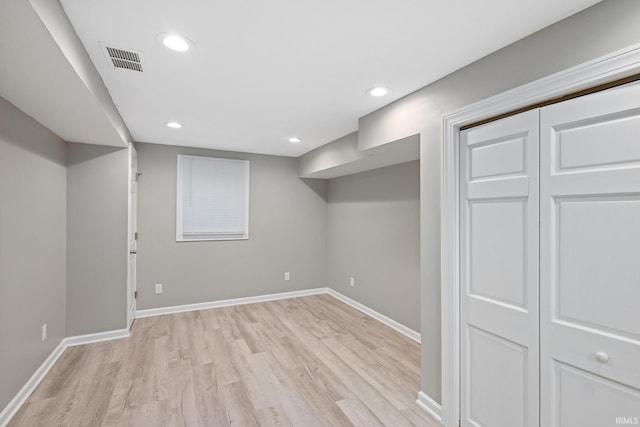 basement featuring light hardwood / wood-style flooring