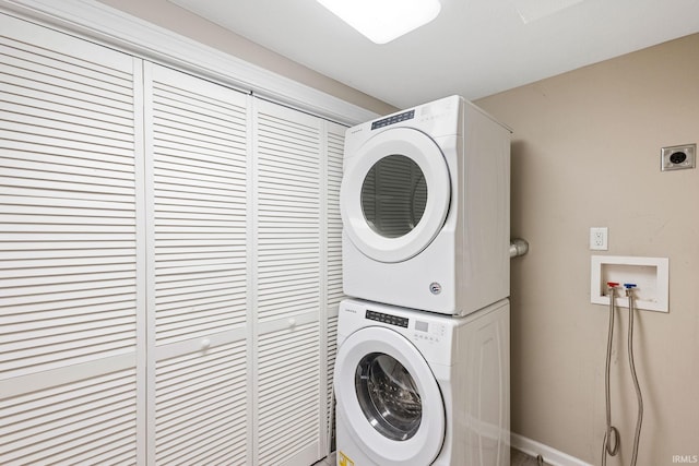 washroom with stacked washer / dryer