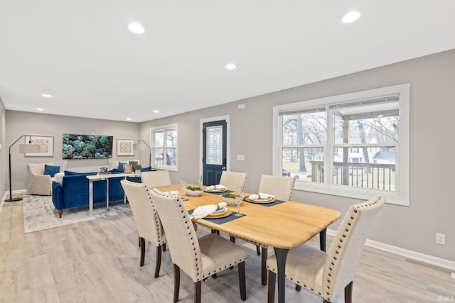 dining area with light hardwood / wood-style floors