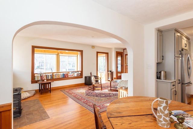 dining room with a wealth of natural light and light hardwood / wood-style floors