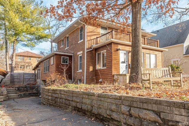 view of property exterior featuring a balcony