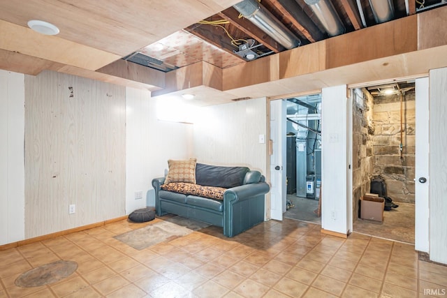 basement featuring wood walls