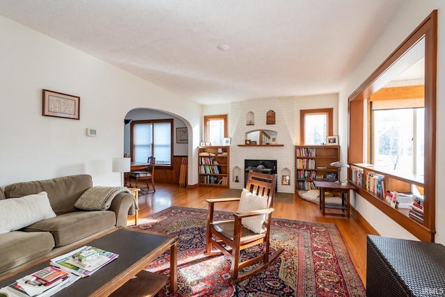 living room with a fireplace and light hardwood / wood-style floors