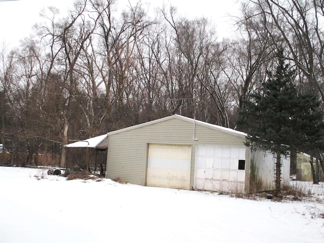 view of snow covered garage