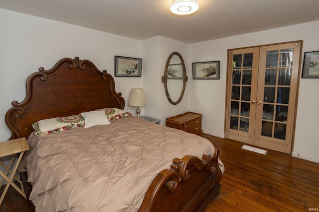 bedroom with french doors and dark hardwood / wood-style floors