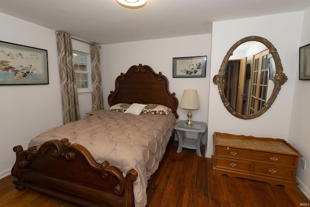 bedroom featuring dark wood-type flooring