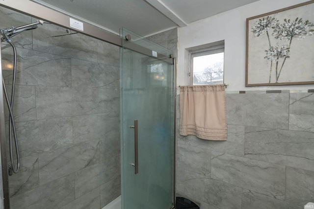 bathroom with a shower with shower door