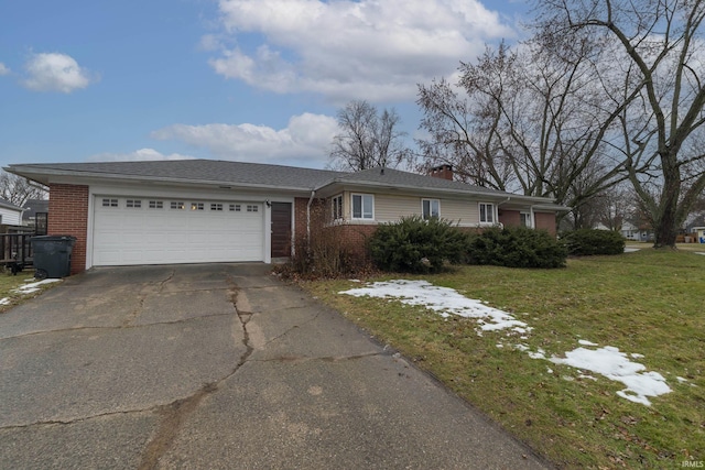 ranch-style home featuring a garage and a front lawn