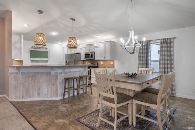 dining space featuring a notable chandelier