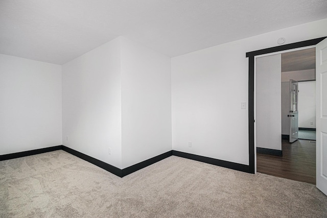 empty room with carpet flooring