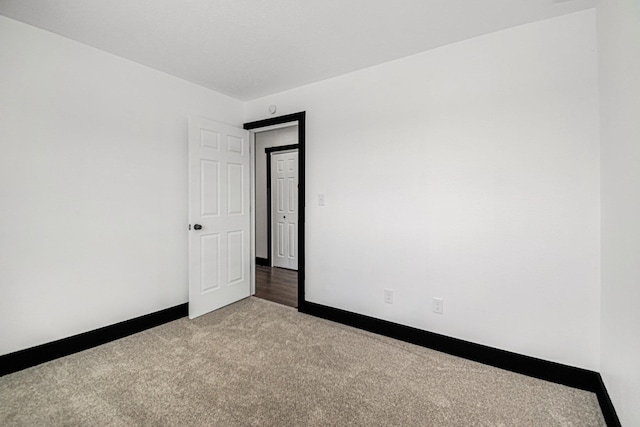 empty room with light colored carpet