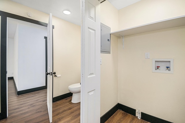 laundry area with dark wood-type flooring, washer hookup, and electric panel