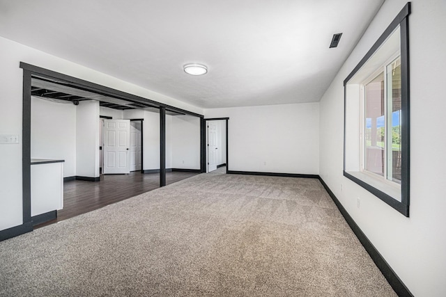 interior space with dark carpet