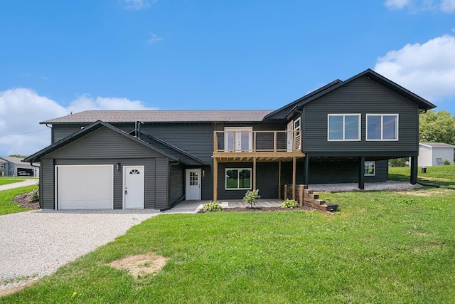 view of front of house featuring a wooden deck, a garage, and a front yard