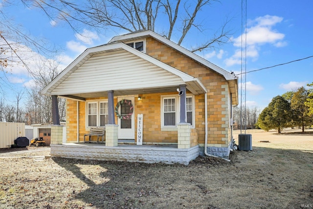 bungalow-style house featuring central AC and covered porch